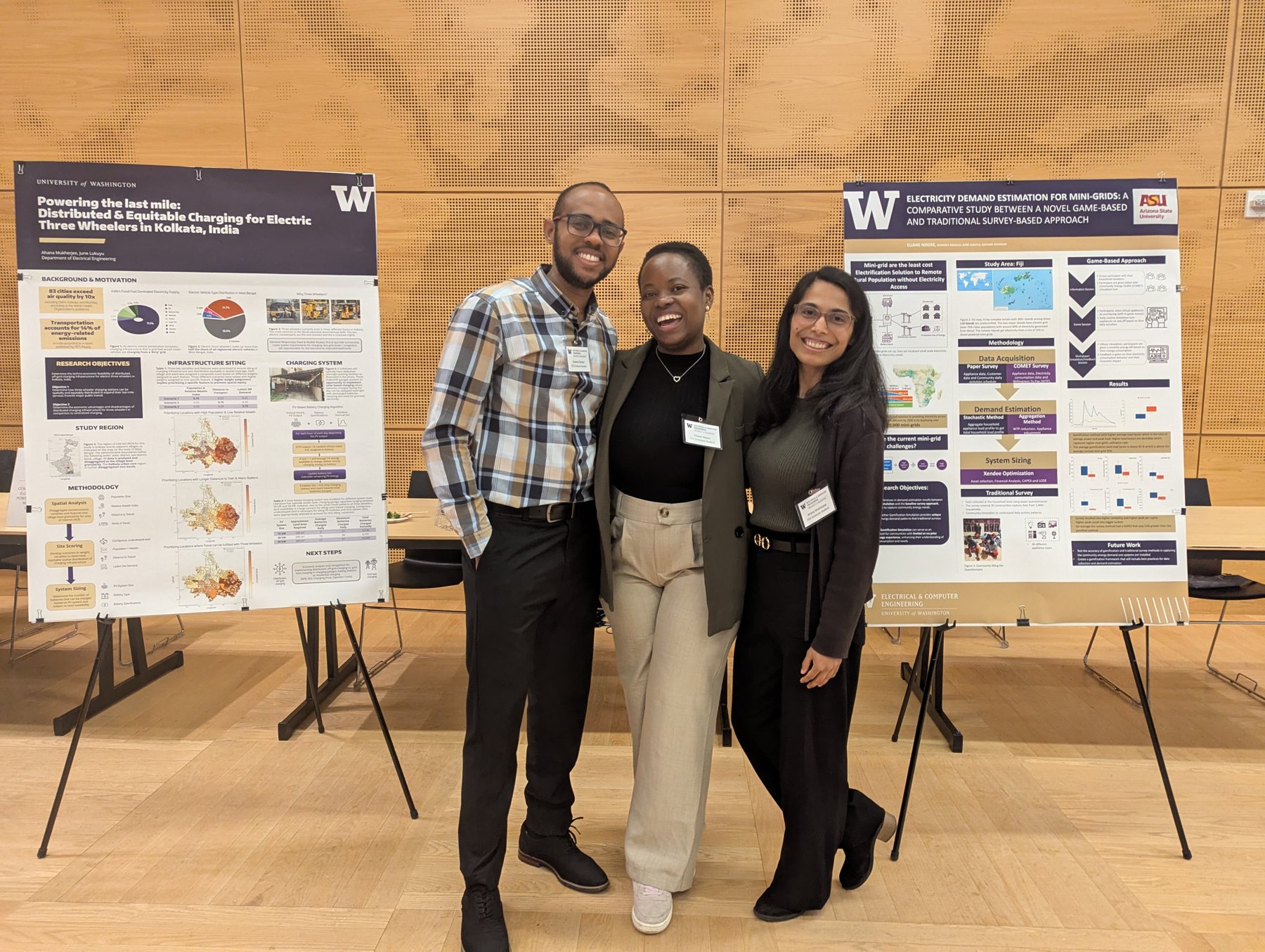 Three IDEAS researchers standing beside their research posters